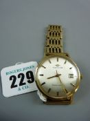 A GENTLEMAN'S MOVADO WRISTWATCH, a gold encased circular dial calendar wristwatch with five bar nine