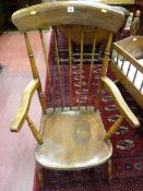 A 19TH CENTURY ASH FARMHOUSE ARMCHAIR, wide top rail with spindle back and turned arm and lower