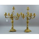 A PAIR OF FIVE BRANCH BRASS CANDELABRA, probably Continental, early 20th Century in heavy Rococo