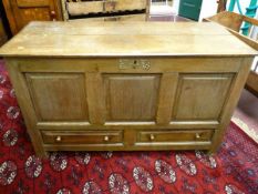 AN 18TH CENTURY OAK MULE CHEST, twin plank chamfered edge top over a three panel front with two