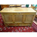 AN 18TH CENTURY OAK MULE CHEST, twin plank chamfered edge top over a three panel front with two