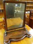 A VICTORIAN MAHOGANY TOILET MIRROR on a shaped platform base, 67 x 59 cms