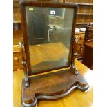 A VICTORIAN MAHOGANY TOILET MIRROR on a shaped platform base, 67 x 59 cms