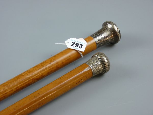 TWO MALACCA SILVER TOPPED WALKING CANES, 84 and 91 cms respectively