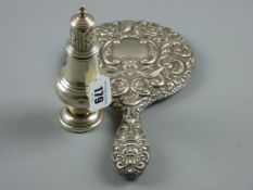 AN EMBOSSED DRESSING TABLE MIRROR, hallmarked Birmingham 1909 with a silver muffineer, hallmarked