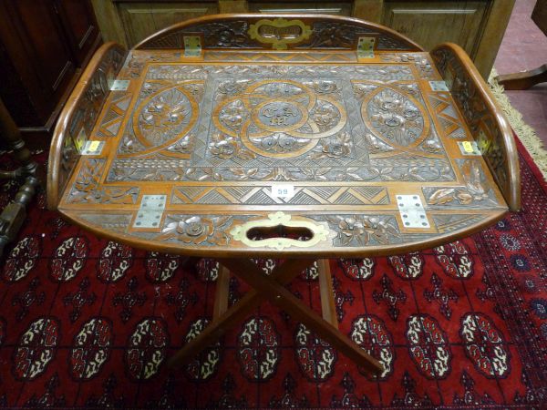 A CARVED MAHOGANY BUTLER'S TRAY AND STAND the tray with hinged sides and brass mounted handle