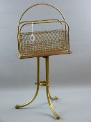 AN OAK AND BRASS NEWSPAPER STAND, late 19th/early 20th Century with wirework separators, iron swivel