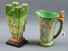 AN ART DECO CASTELLATED VASE AND HAND PAINTED JUG, the jug marked Myott Son & Co with a young boy in