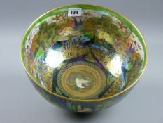 A WEDGWOOD 'FAIRYLAND' LUSTRE BOWL, a 27.5 cms diameter bowl decorated to the interior with woodland