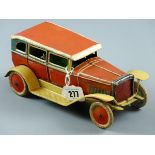 A CIRCA 1920 CLOCKWORK TINPLATE SEDAN CAR litho decorated 6 x 24 balloon tyres and body (