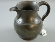 A LARGE PEWTER JUG, a large bulbous beer jug with swept handle and large filtered spout, 15 cms