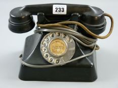A GEC BLACK BAKELITE TELEPHONE pyramid style with hand piece cradle and chrome plated number dial,