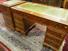 A YEW WOOD TWIN PEDESTAL DESK AND MATCHING FILE CABINET, gilt tooled green leather top over three