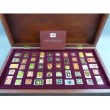 REGIMENTAL TABLETS, a cased set of fifty Franklin Mint enamel and non precious metal regimental