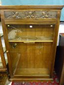 A SINGLE GLASS DOOR DISPLAY CABINET, 20th Century with carved acorn and oak leaf decoration with