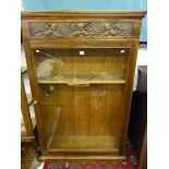 A SINGLE GLASS DOOR DISPLAY CABINET, 20th Century with carved acorn and oak leaf decoration with