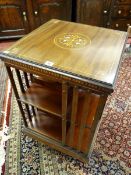 AN INLAID REVOLVING BOOKCASE, mahogany with box wood stringing, ivory and multi-wood inlay roundel