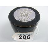 A SMALL CYLINDRICAL BLACK LACQUERED RING BOX, the lid inset with a silver crown and monogram and