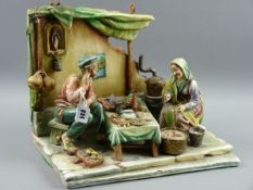 AN ANTONIO BORSATO ITALIAN PORCELAIN GROUP depicting an elderly couple preparing their food before a