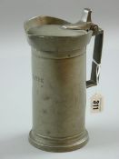 A PEWTER BEER JUG, 19th Century continental capstone shaped, the hinged lid below a flared rim and