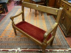 A VICTORIAN MAHOGANY OPEN BACKED BENCH, deep cross rail, swept arms on turned and block supports