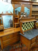 AN EDWARDIAN RED WALNUT THREE PIECE BEDROOM SUITE of two door mirrored wardrobe with lower drawer,