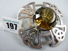 A LARGE SILVER CELTIC TYPE BROOCH with centre smoky quartz stone, 65 grms (2 ozs gross) Edinburgh