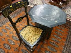 AN EASTERN BLACK LACQUERWORK FOLDING TABLE AND A CHINOISERIE DECORATED BEDROOM CHAIR, the