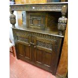 A REPRODUCTION OAK COURT CUPBOARD, quality carved with substantial pineapple style supports,