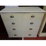 A CIRCA 1900 PAINTED PINE CHEST of two short over three long drawers under a moulded top with chrome