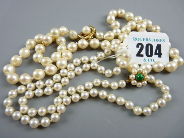 TWO PEARL NECKLACES each with yellow metal pearl mounted clasps (one marked fourteen carat), 54 grms