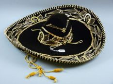 A MEXICAN GOLD SOMBRERO, a superbly preserved and authentic Mexican sombrero, black ground with