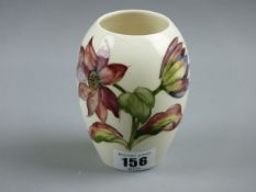 A MOORCROFT DAHLIAS VASE, an 11 cms high vase decorated on a cream ground, impressed to the base '