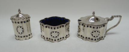 A THREE PIECE SILVER CONDIMENT SET comprising mustard pot with hinged lid, pepperette and salt, each