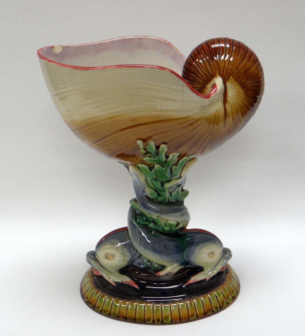 A MINTON MAJOLICA NAUTILUS SHELL CENTRE-PIECE, supported on a seaweed column with intertwined