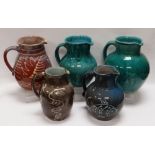 A WILLIAM FISHLEY HOLLAND STUDIO POTTERY GROUP OF FIVE JUGS in various slipware glazes and