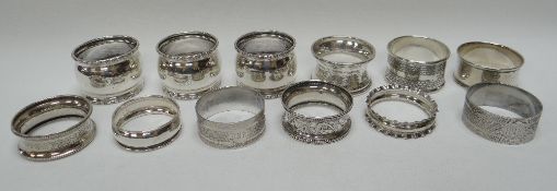 TWELVE SILVER NAPKIN RING HOLDERS including a pair and a trio, 5.6ozs