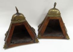 A PAIR OF NINETEENTH CENTURY CARVED GAUCHO STIRRUPS of pyramidal form and with brass mounting, 26cms