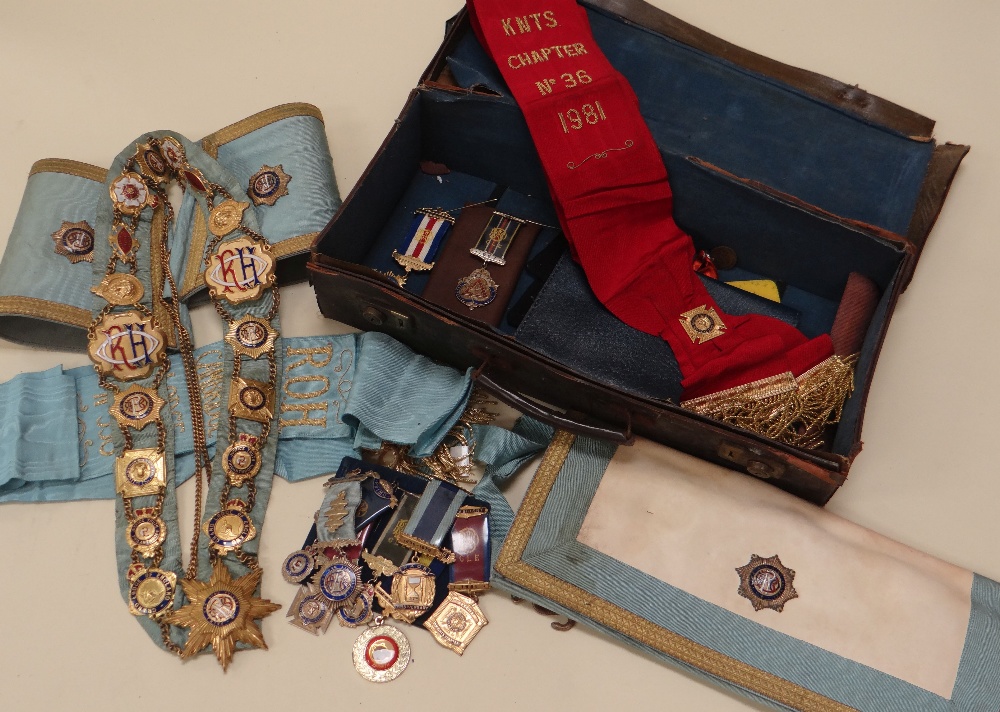 A CASE OF MASONIC REGALIA including silver medals, aprons and sashes etc