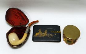 THREE SMOKING ANTIQUES being a Japanese gold inlaid metallic cigarette case, a brass trench-art