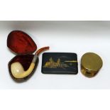 THREE SMOKING ANTIQUES being a Japanese gold inlaid metallic cigarette case, a brass trench-art