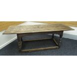 AN EARLY OAK REFECTORY TABLE on turned and block supports and with rectangular floor level