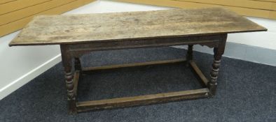 AN EARLY OAK REFECTORY TABLE on turned and block supports and with rectangular floor level