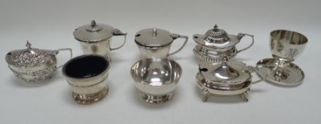 A PARCEL OF EIGHT SILVER TABLEWARE ITEMS comprising five mustard pots, an egg cup and two circular