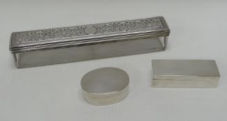 TWO SILVER PILL BOXES & A SILVER LIDDED GLASS DRESSING-TABLE BOX