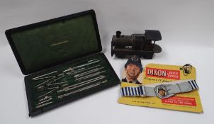 A 'DIXON OF DOCK GREEN' TOY BELT, A BING WORKS PARAFFIN LOCOMOTIVE & A CASED VINTAGE DRAWING SET