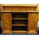 AN ARTS AND CRAFTS OAK SIDEBOARD manner of Charles Bevan composed of three centre open shelves