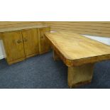 A MAPLE WOOD ART DECO DINING TABLE AND SIDEBOARD the table of rounded rectangular form on a pair