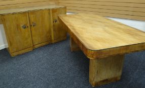 A MAPLE WOOD ART DECO DINING TABLE AND SIDEBOARD the table of rounded rectangular form on a pair