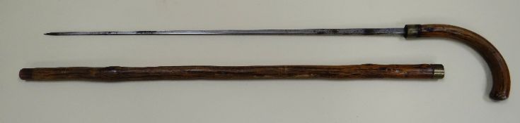 A WOODEN SWORDSTICK with brass ferrule engraved 'VHF', 91cms long